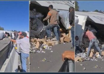 El chofer de un tráiler murió tras volcarse su unidad; la gente llegó a la rapiña pero nadie ayudó al lesionado cuando seguía con vida. Foto: Captura de video